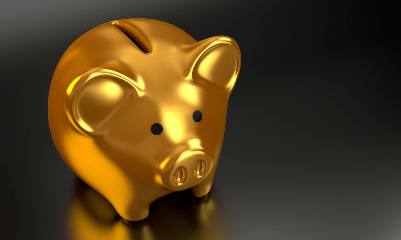 Golden piggy bank representing how rising interest rates make debt more expensive